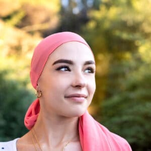 woman wearing head scarf thining about hormone-free birth contrl options