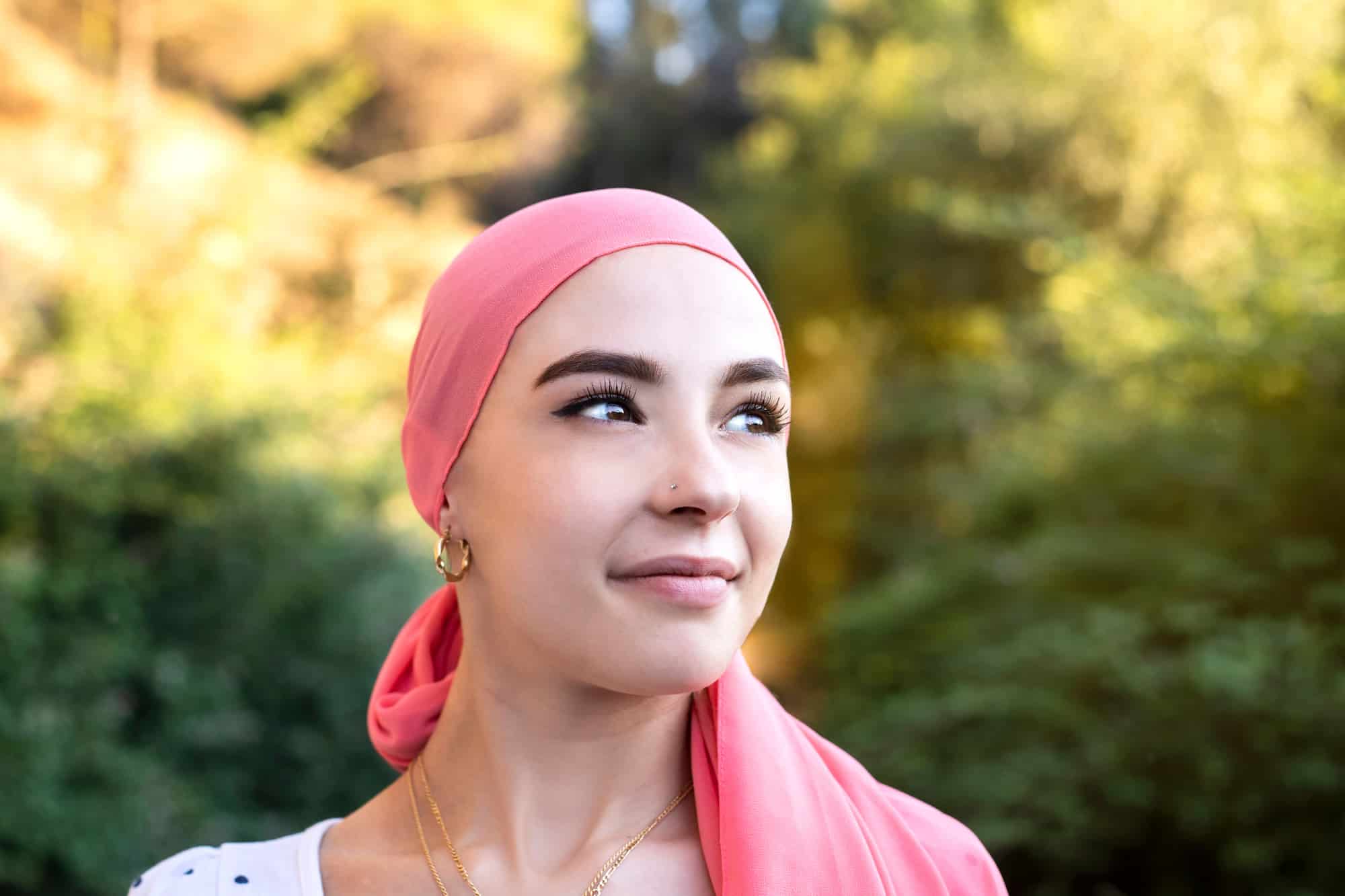 woman wearing head scarf thining about hormone-free birth contrl options