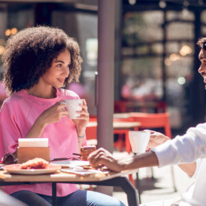 Coffee outside. Cute young couple having coffee in the cafe
